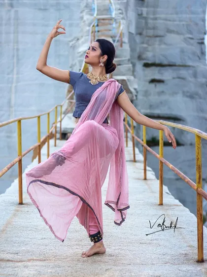 Capturing the art of 'Natyam'. This photo showcases the powerful and graceful form of Bharatanatyam, with the dancer's pose creating a dynamic shape against the stark, textured background of the quarry.