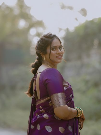The gorgeous Chetana on her Punyahwachan ceremony. I created a soft, romantic look with a braided hairstyle to match the serene outdoor setting.