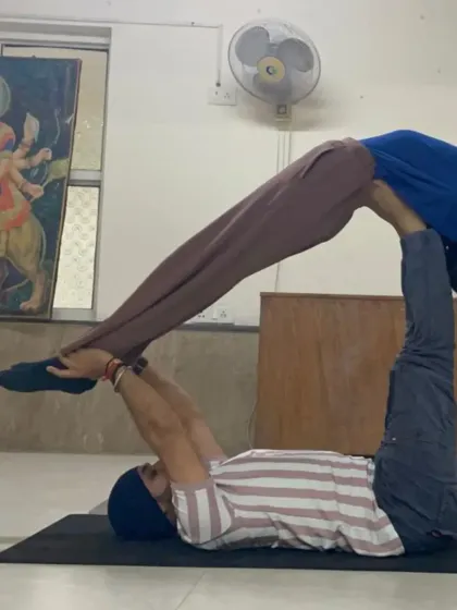 This Acro Yoga pose, known as 'supported bridge', allows the flyer to experience a deep, passive backbend while feeling completely secure.