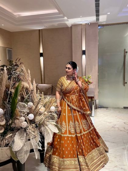 Posing by the beautiful decor, feeling festive in my traditional attire.