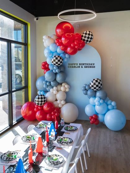 The full setup for the twin's race car party, including a decorated table ready for the little guests.