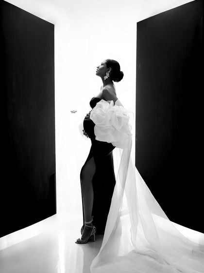A powerful and artistic silhouette. This high-contrast black and white shot is a true statement piece for any maternity gallery.