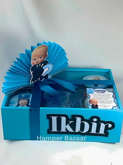 A complete look at the personalized Boss Baby hamper for Ikbir, featuring a custom name, themed topper, and goodies inside.