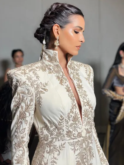 A final look at the model before she walks the ramp for Manish Malhotra, capturing the elegance of the complete ensemble.