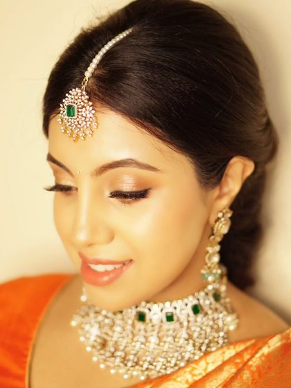 A downward glance showing the delicate eye makeup for Priyanka's baby shower. The look is subtle, elegant, and designed to enhance her natural beauty.