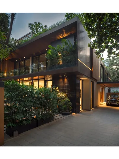 The 'Regeneration of a 70's Suburban Build' in Mumbai by A L V A architects showcases how an old structure can be transformed into a modern, green-filled home.