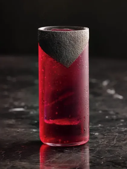 A visually striking red highball with a unique textured rim. The deep color and clean lines make this a sophisticated choice.