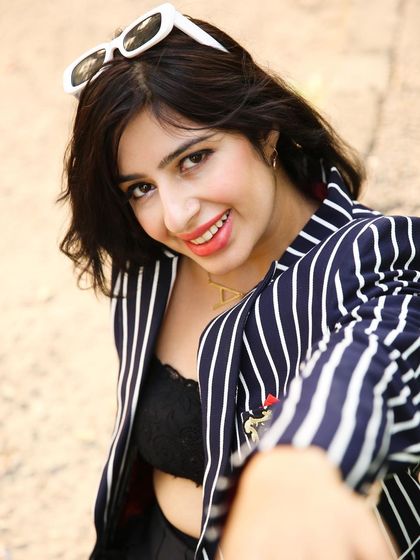 A close-up, engaging portrait taken during an outdoor shoot. I focus on capturing personality and making the model feel comfortable in front of the camera.