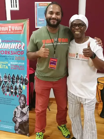 With my guru, the late Grandmaster Mamady Keïta. The time I spent learning from him is the foundation of my craft. I use the traditional djembe making and tuning methods he passed down to me to honor his legacy.