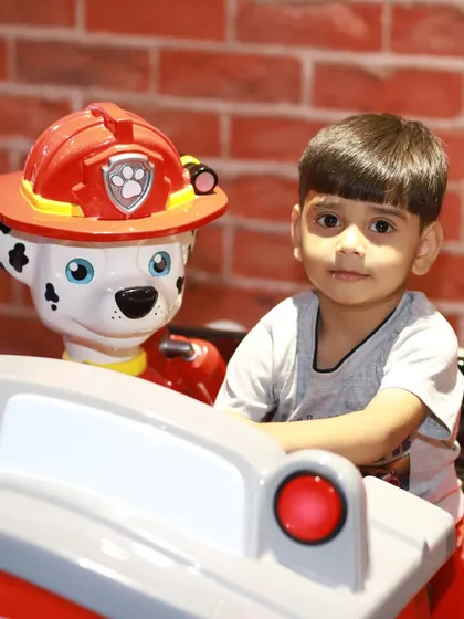 All paws on deck! A young adventurer gets ready to save the day on our popular Paw Patrol fire truck ride. Our kiddie rides and arcade section offer a different kind of excitement for when it's time for a break from climbing and sliding.