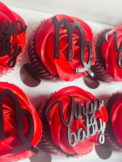 This set was created for a Virgo's birthday celebration. Like the Leo set, these feature a striking red buttercream on a chocolate base, but with custom acrylic toppers for the Virgo zodiac sign and "Virgo Baby" text.
