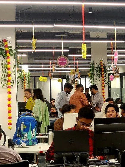 Even the main workspace was part of the celebration. I hung festive decor from the ceiling across the entire office floor, including marigold garlands and Bollywood-themed cutouts, ensuring everyone felt the festive energy right at their desks.