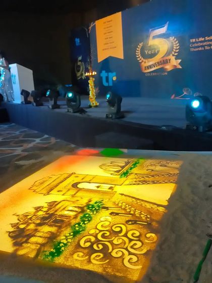 My lightbox glowing and ready for a show for TR Lifesciences, celebrating their 5th anniversary. The artwork on the table is a colourful depiction of their journey.