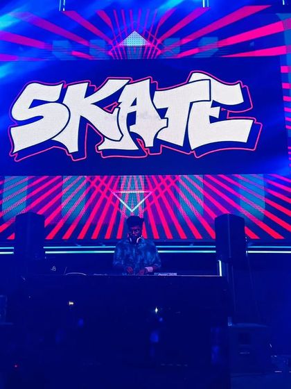 A solo shot of me at the console with my "SKATE" logo displayed prominently on the LED screen behind me.