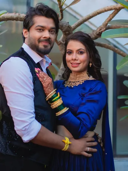 A happy and confident couple. The bride's sangeet look is all about glamour, with a focus on dramatic eyes.