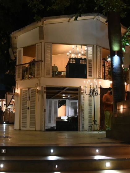 The exterior of our two-story dining building at night. It stands as a beautiful centerpiece to the entire venue.