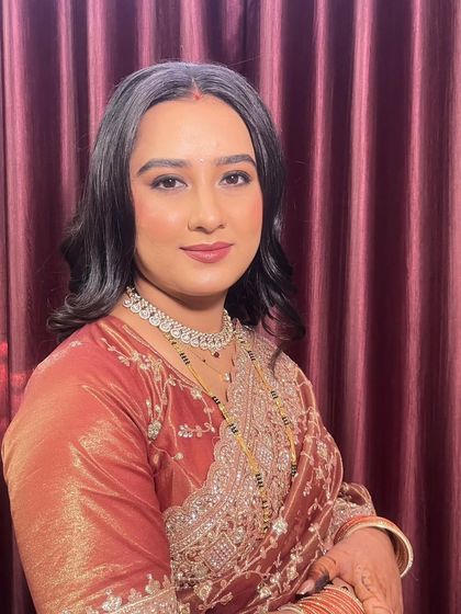 A beautiful portrait of the bride, looking confident and serene. The makeup is flawless and perfectly suited for an evening reception.