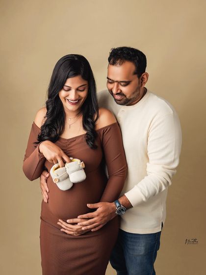 Incorporating little props like baby booties makes the moment feel even more real. This is a sweet way to announce your pregnancy or just to have as a keepsake.