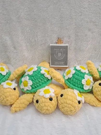 Another shot of the adorable turtle family, ready to be gifted. Each one is 10 inches long and decorated with little daisy flowers.