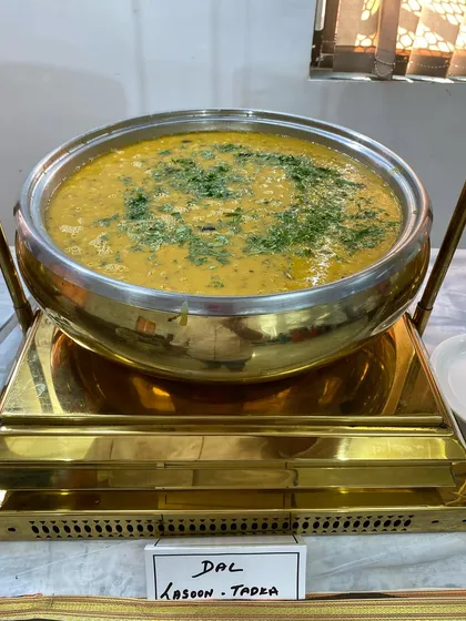 Dal Lasooni Tadka, a yellow lentil curry with a strong, aromatic garlic tempering.