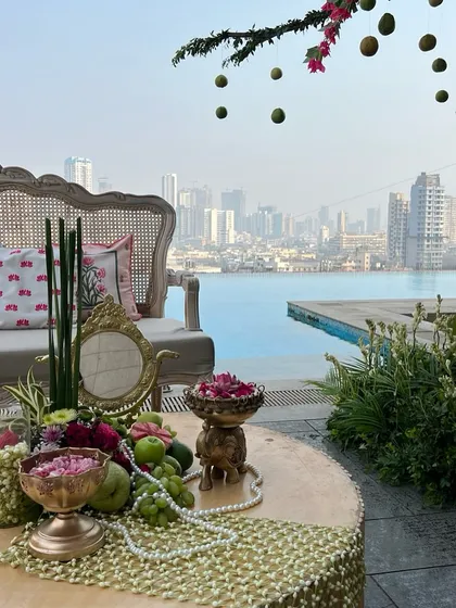 The tablescape detail with the city skyline as a backdrop, blending urban chic with traditional elegance.