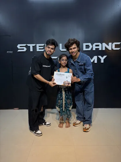 Sagun with her certificate, a testament to her hard work.