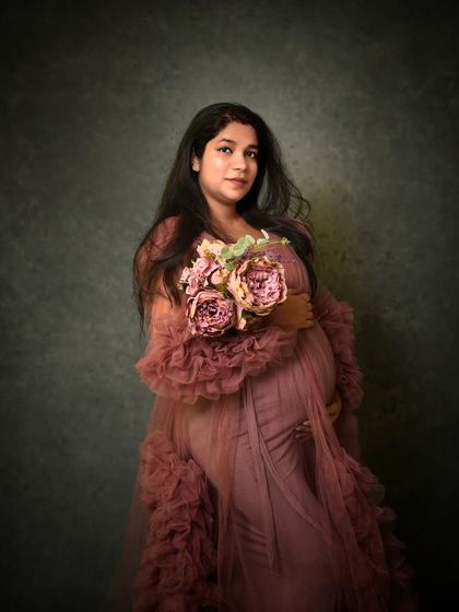 A standing portrait holding a bouquet of peonies. This pose highlights the beautiful texture and flow of this gown from my client wardrobe.