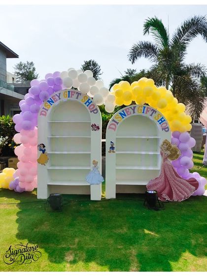 Every little guest at the princess party got to visit the 'Disney Gift Shop'. This custom shelving unit, framed by a balloon arch, was used to display party favours.