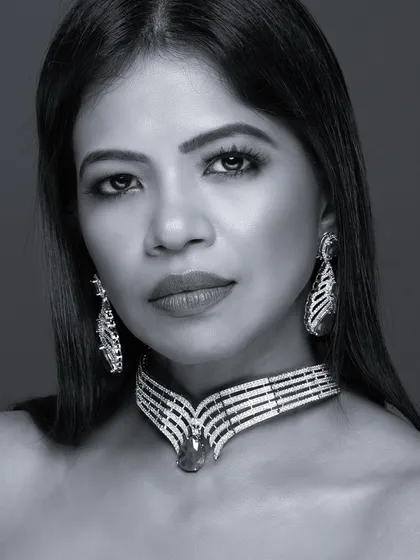A black and white beauty close-up showcasing a stunning diamond and emerald choker. The monochrome edit gives it a timeless, classic Hollywood feel.