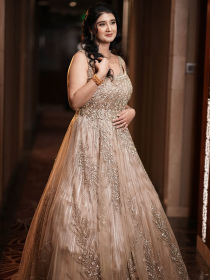 A full-length portrait of the bride-to-be in her gorgeous gown. The makeup and hair complete her elegant look.