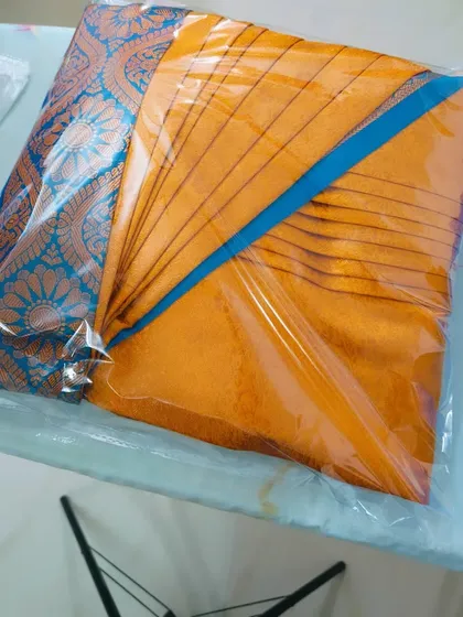 Another example of a saree packed and ready to go. This is a great option for gifting a saree as well, as it looks beautifully presented.