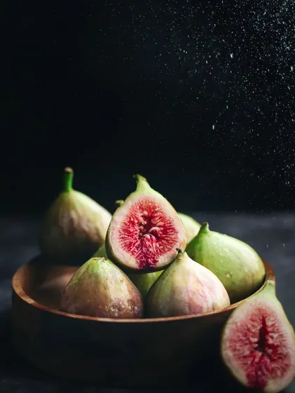 I love shooting fresh produce. This moody, dramatic shot of fresh figs uses a water spritz to enhance their freshness and a dark background to make their beautiful color pop.