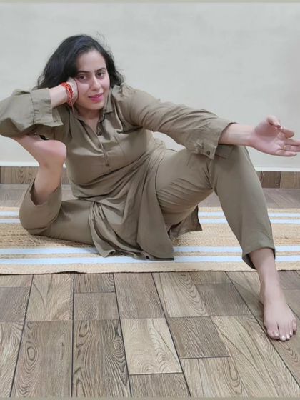 A playful and advanced hip-opening pose. This asana requires significant external rotation in the hips and is a testament to a dedicated flexibility practice.