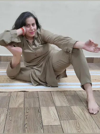 A playful and advanced hip-opening pose. This asana requires significant external rotation in the hips and is a testament to a dedicated flexibility practice.