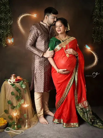 A tender moment captured with a touch of magic. We added subtle light effects to enhance the romance of this traditional Maharashtrian maternity portrait.