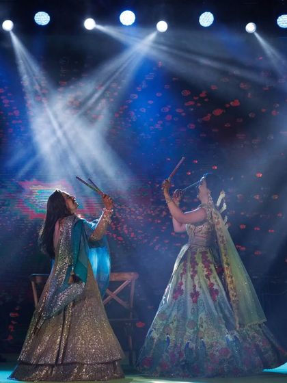 A dandiya-style performance at the Mehendi. Using props like dandiya sticks is a great way to add energy and a traditional touch.