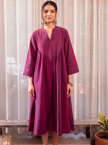 Our Violet Soof Embroidered Dress from the Haveli collection. The A-line silhouette and intricate embroidery make it a perfect choice for festive occasions.