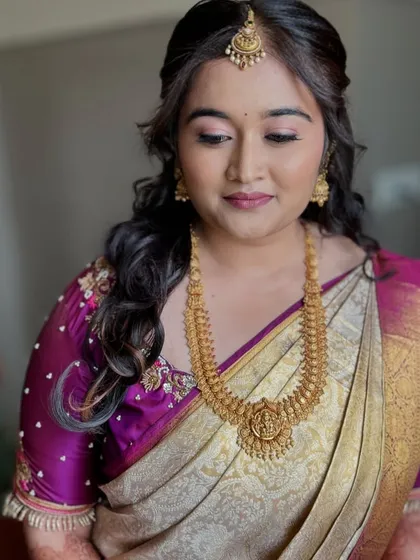 A close-up of Nayana's engagement look, showing the delicate details of her makeup and jewellery.