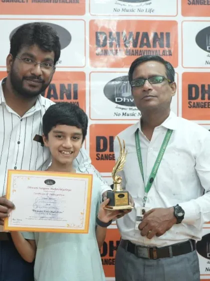 A student receives his trophy from our dedicated art instructors.