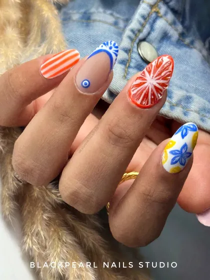 A vibrant and exotic design inspired by Moroccan prints. This set features a mix of orange and lemon themes, with intricate patterns and a juicy 3D effect on the orange nails.