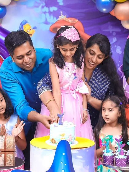A lively cake-cutting scene with family and friends. We capture the energy and excitement of the moment as everyone gathers to sing and celebrate the birthday girl.