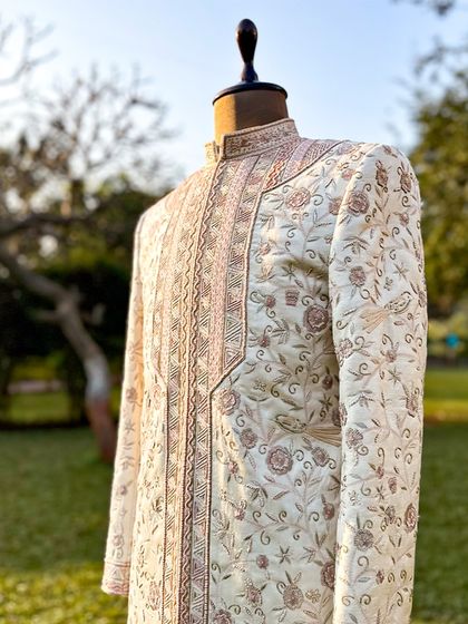 Our Koyaliya Sherwani, crafted from Ahimsa silk and adorned with intricate hand embroidery. Inspired by the symbolism of the koyal bird, this piece embodies romance and tradition.