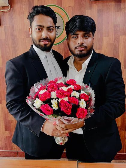 A close-up shot celebrating a colleague's success with a bouquet of flowers.