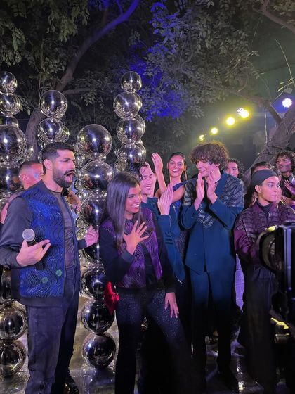 A celebratory moment on stage with designer Rimzim Dadu and the models at the end of her "Disco" themed show.