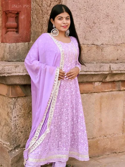 This full-length shot against the stone wall gives a complete view of the ethnic wear set. It demonstrates how I compose images to capture both the person and the details of their attire, perfect for fashion-focused pre-wedding photography.