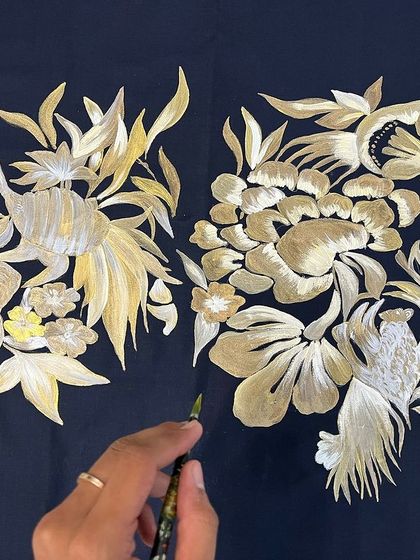 I painted these beautiful gold and antique bronze floral and animal patterns on a dark kurta. The metallic paints catch the light, giving the design a subtle shimmer and a touch of luxury.