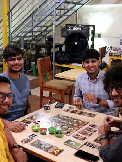 A group of friends enjoying a game of Century: A New World. Our cafe is the perfect spot for your next game night.
