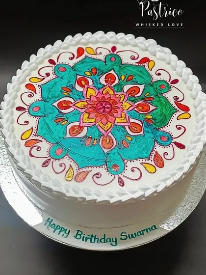 I believe cakes can be art. This cake features a vibrant, hand-painted Mandala design, turning a simple white canvas into a beautiful, edible masterpiece for a truly unique celebration.