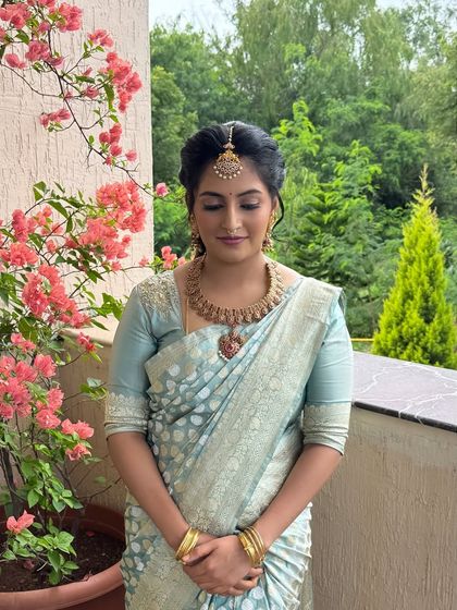 Another shot of Jahnavi's elegant naming ceremony look. The makeup is understated, allowing her natural beauty to shine.