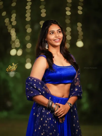 A portrait of actress Sapthami Gowda at an awards event. This shot demonstrates my ability to capture candid, natural smiles even in the midst of a large public function, using the ambient lighting to create a soft, flattering look.